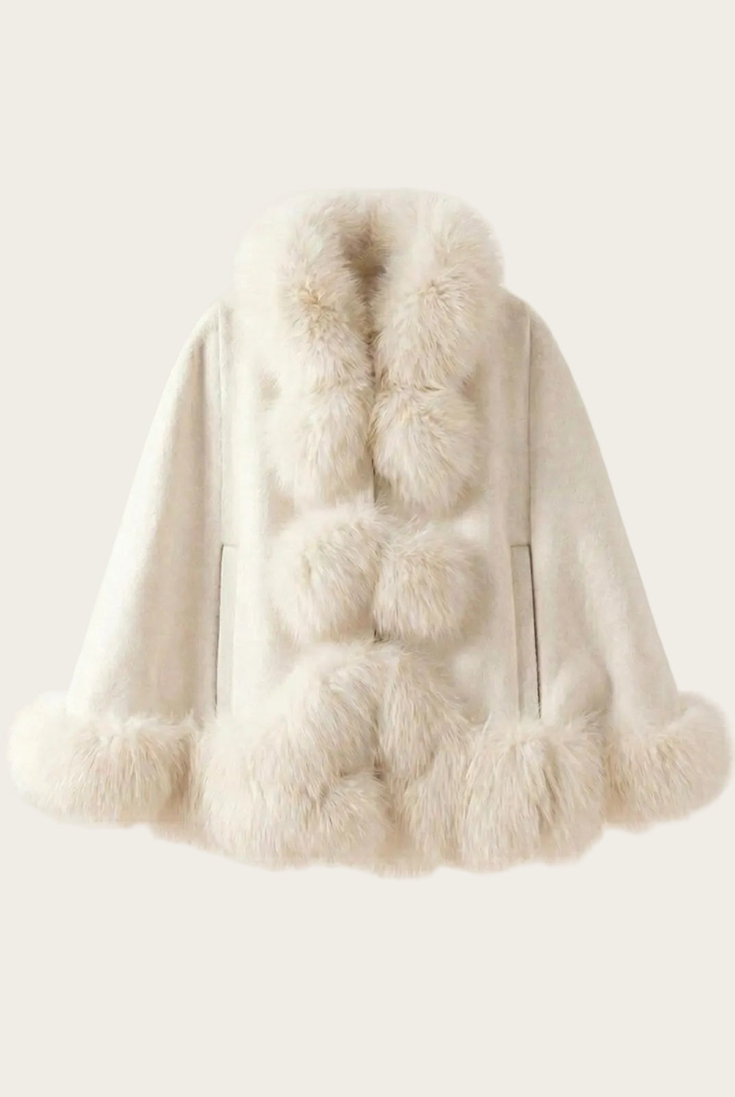 White fur coat with pom-pom details on a light gray background